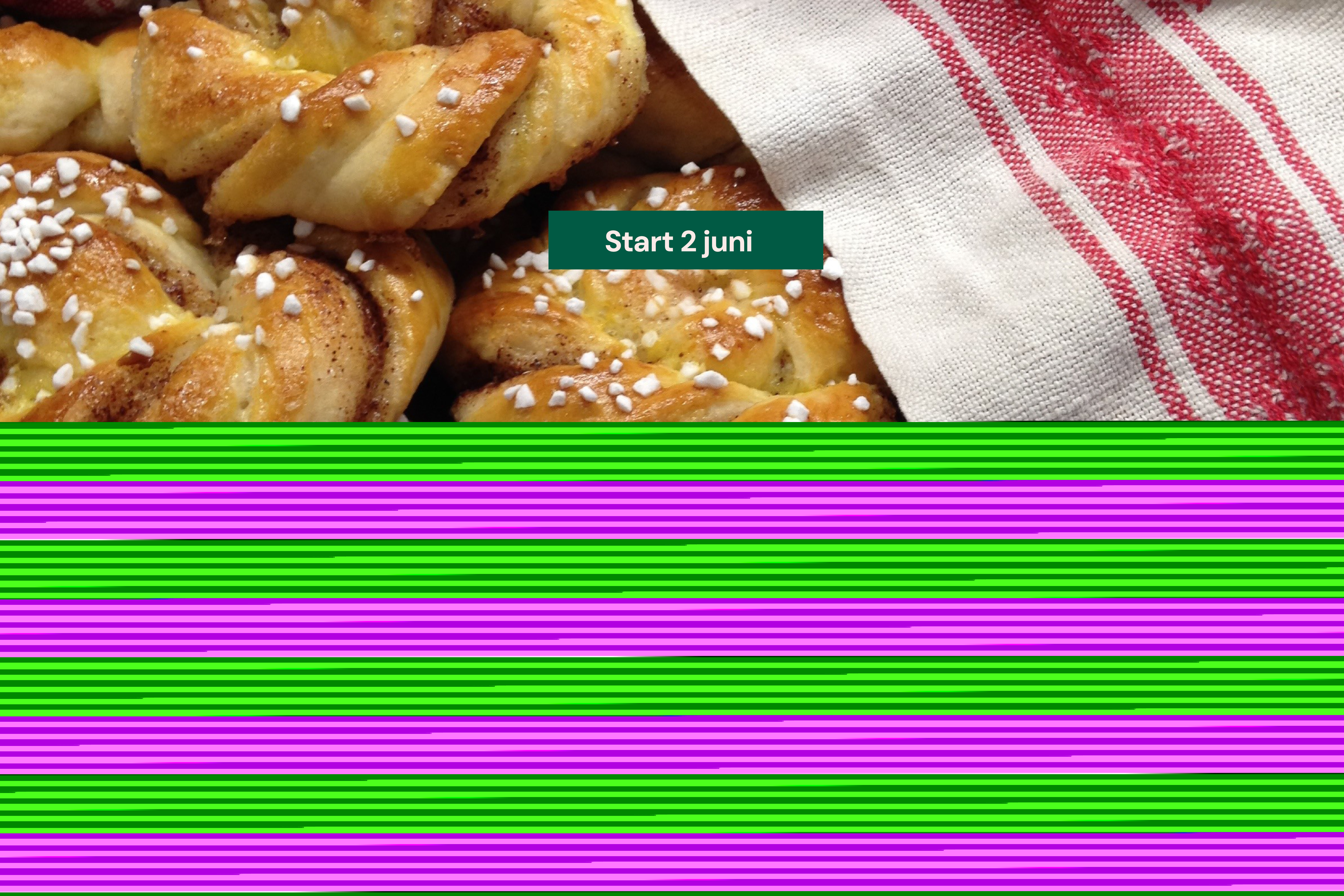 Bilden visar nybakta kanelbullar under en röd och vit bakduk.